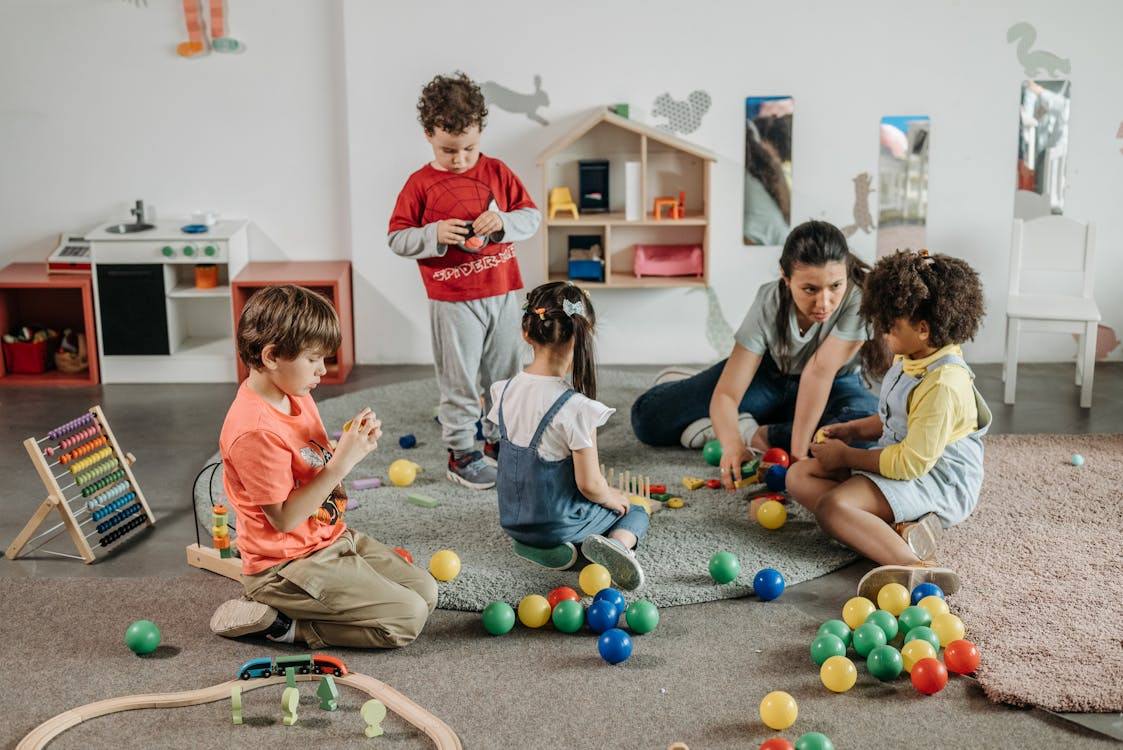 Children playing with a caregiver in a verified Tusla creche